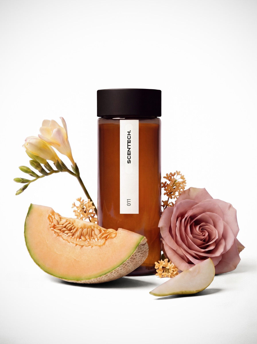 A sealed 65 ml Scentech ScentPod in the Freesia Veil fragrance, standing beside its box